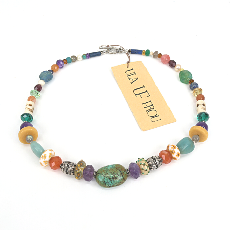 Colourful beaded necklace with turquoise, amethyst, carnelian, Lapis lazuli, and rose quartz stones, and beads made from bone, crystal, sterling silver, flame-worked and recycled glass. Designed and handcrafted by Ula Frou creator Sadie Hodson on Salt Spring Island.